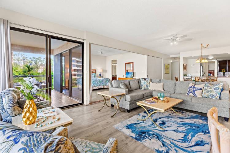 Spacious living room in a 3-bedroom vacation rental at the Sands of Kahana in Maui, featuring comfortable seating, bright natural light, and plenty of room for families to relax.