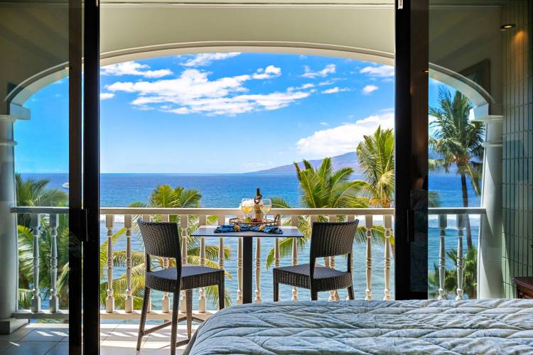 Balcony seating in a vacation rental at the Lahaina Shores 635, an oceanfront beach resort unit in Maui, HI.