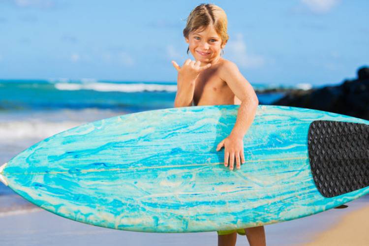 Young Boy With Surfboard