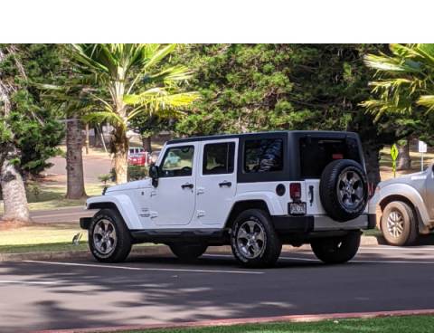 Lanai Car Rental A white Jeep Wrangler on the island of Lanai