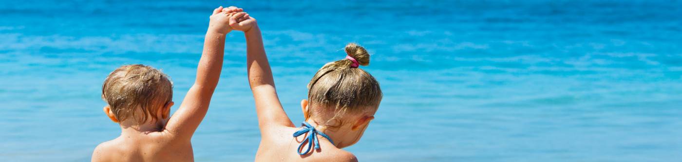 Toddlers playing on a Maui Beach