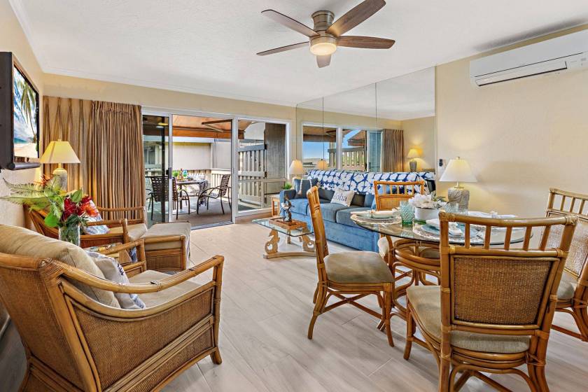 Pristine vacation condo in West Maui on Kahana Sunset resort that features beautiful mid-century bamboo furniture and view of private lanai