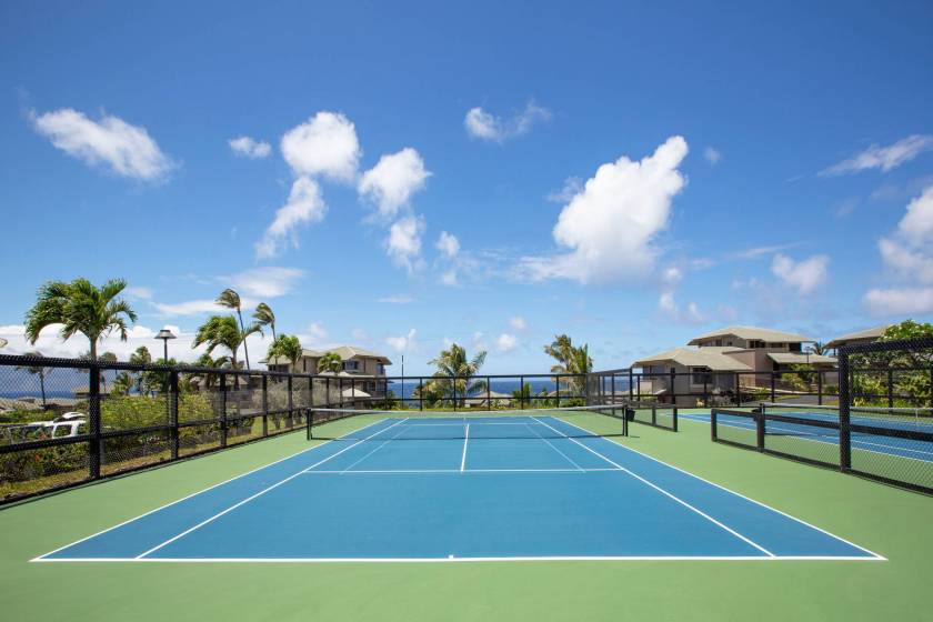 Kapalua Bay Villas tennis courts under a clear blue sky.