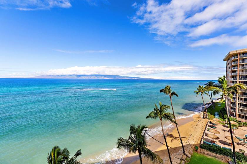 Beautiful, sprawling view of the ocean from a Maui vacation rental with private lanai. Molokai is in the distance