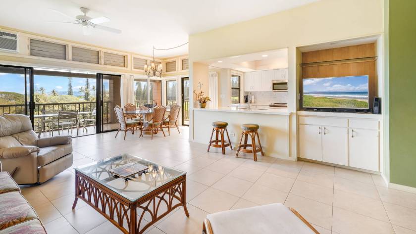 View of licing area, full kitchen, and dining area in Kapalua Ridge Villa condo rental, West Maui, HI