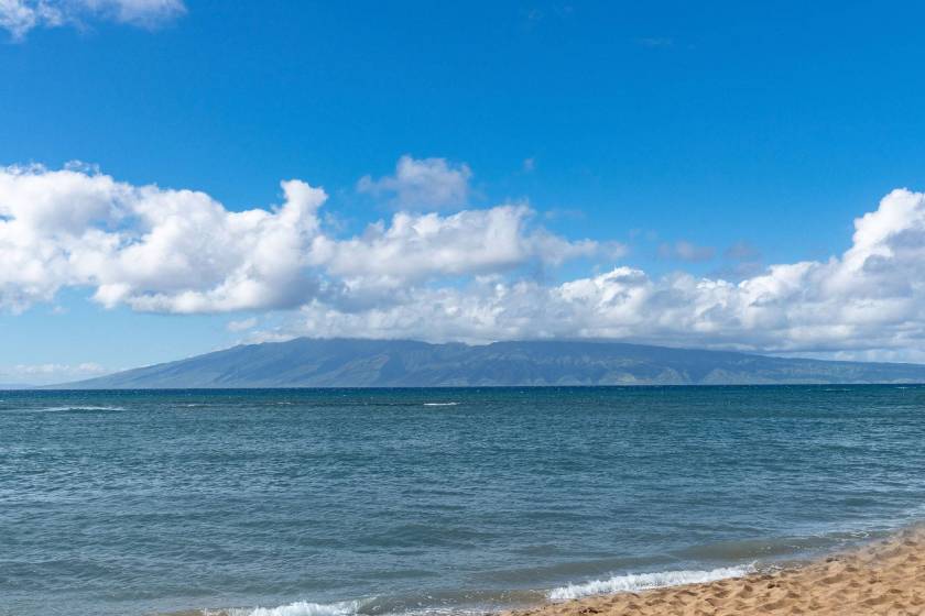 View from private lanai in Royal Kahana condo rental of the open ocean and Molokai in the distance.