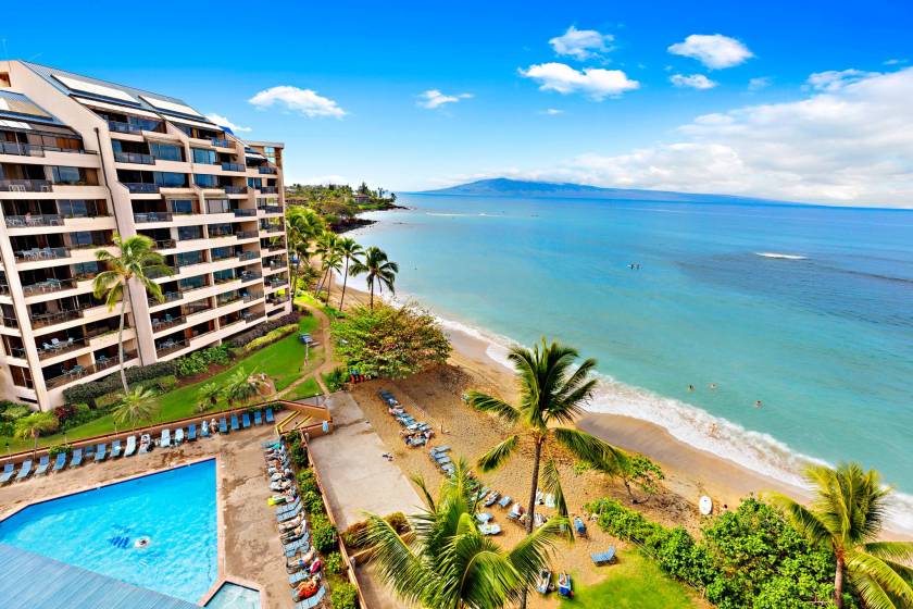 Aerial view of swimming pool and beach, just a short distance away from private condo at Sands of Kahana resort.